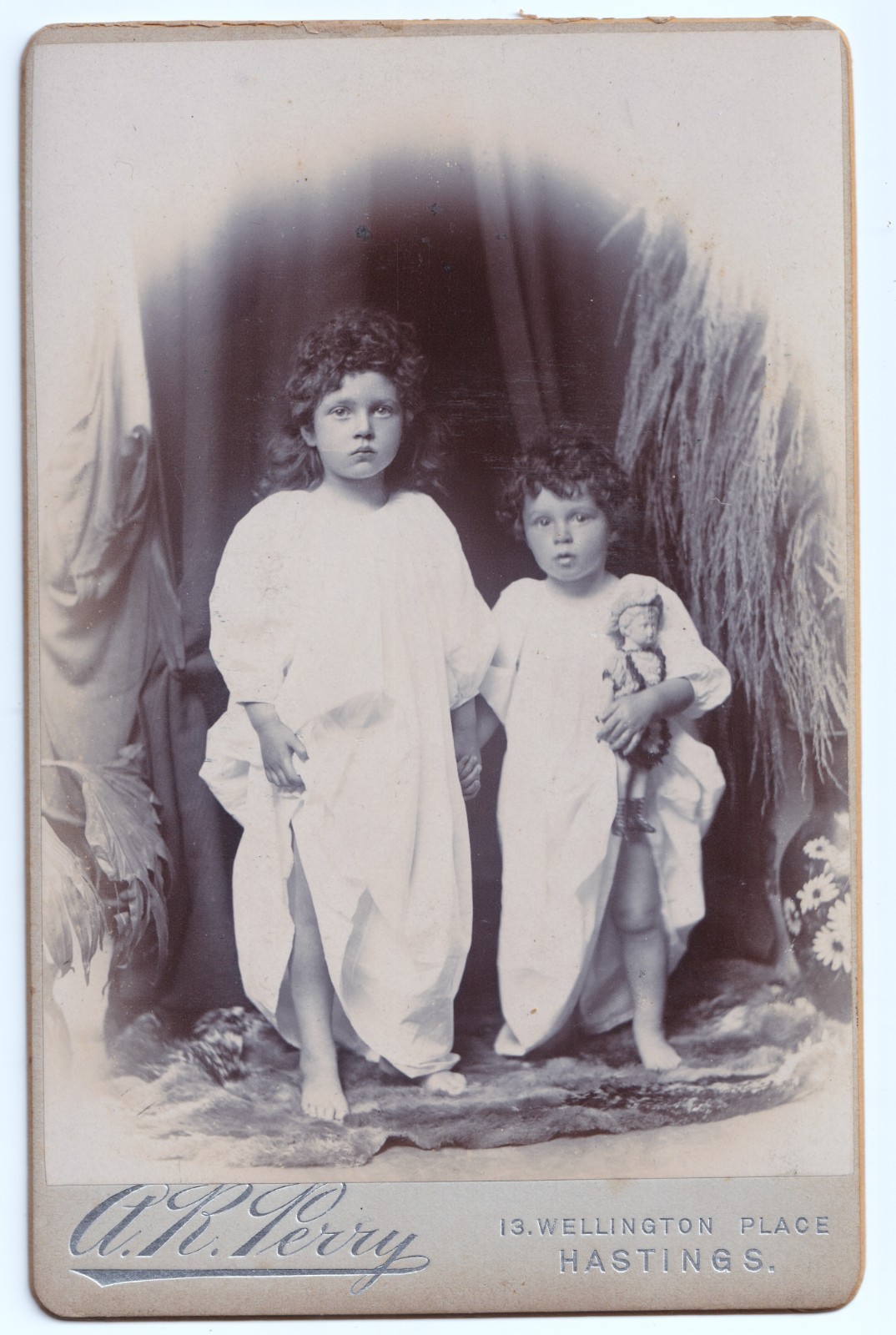 Cabinet Card: Cabinet Card: Children with Doll. A.R. Perry, Hastings.: catalogue image 1