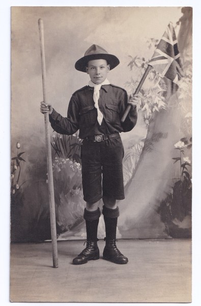Postcard: Postcard: Boy Scout in Uniform Holding Flag and Staff. Real Photograph.: catalogue image 1