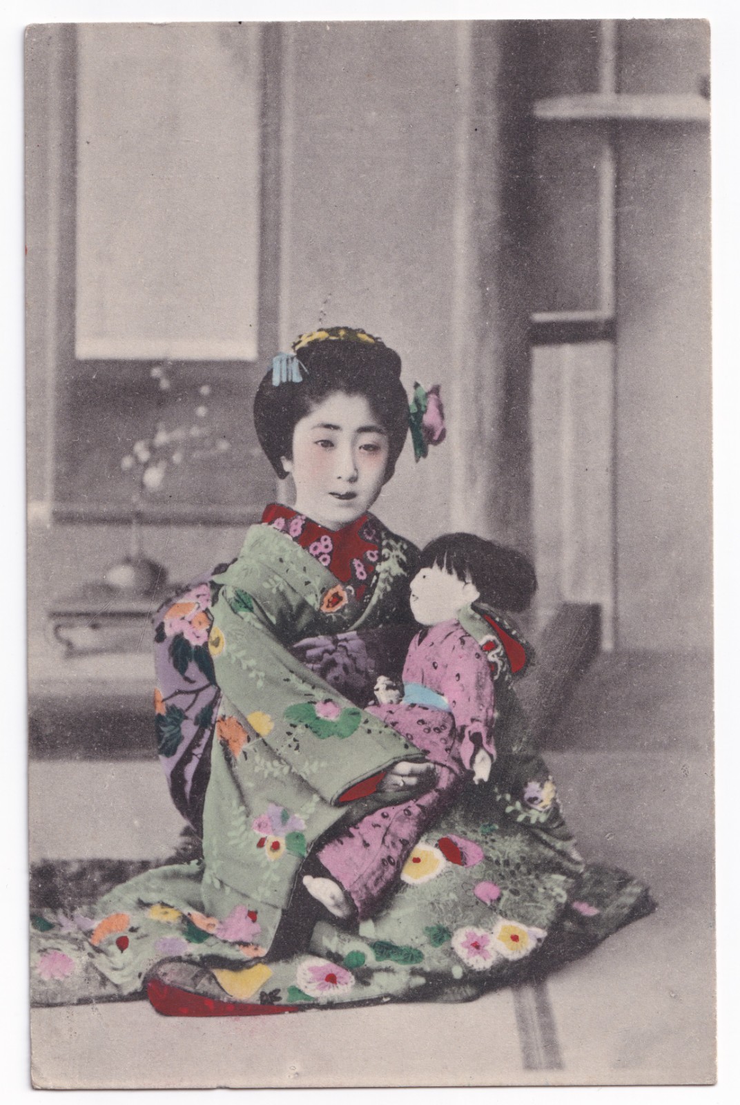 Postcard: Postcard, Japanese Female in Traditional Dress Holding A Doll, Hand Tinted.: catalogue image 1